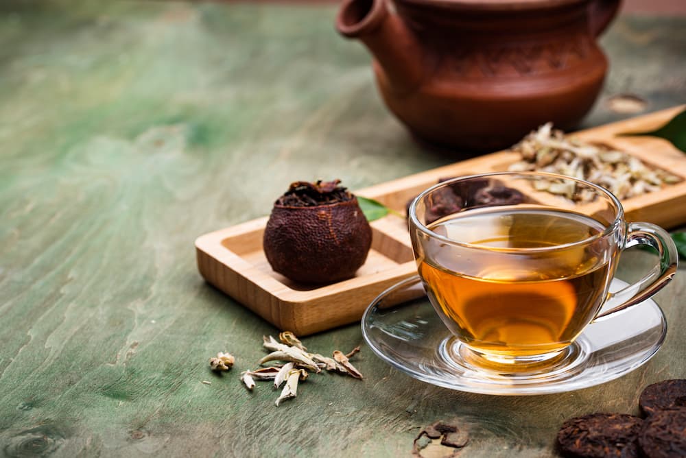 Pu Erh Tea 101 Health Benefits And Brewing Tips Heall